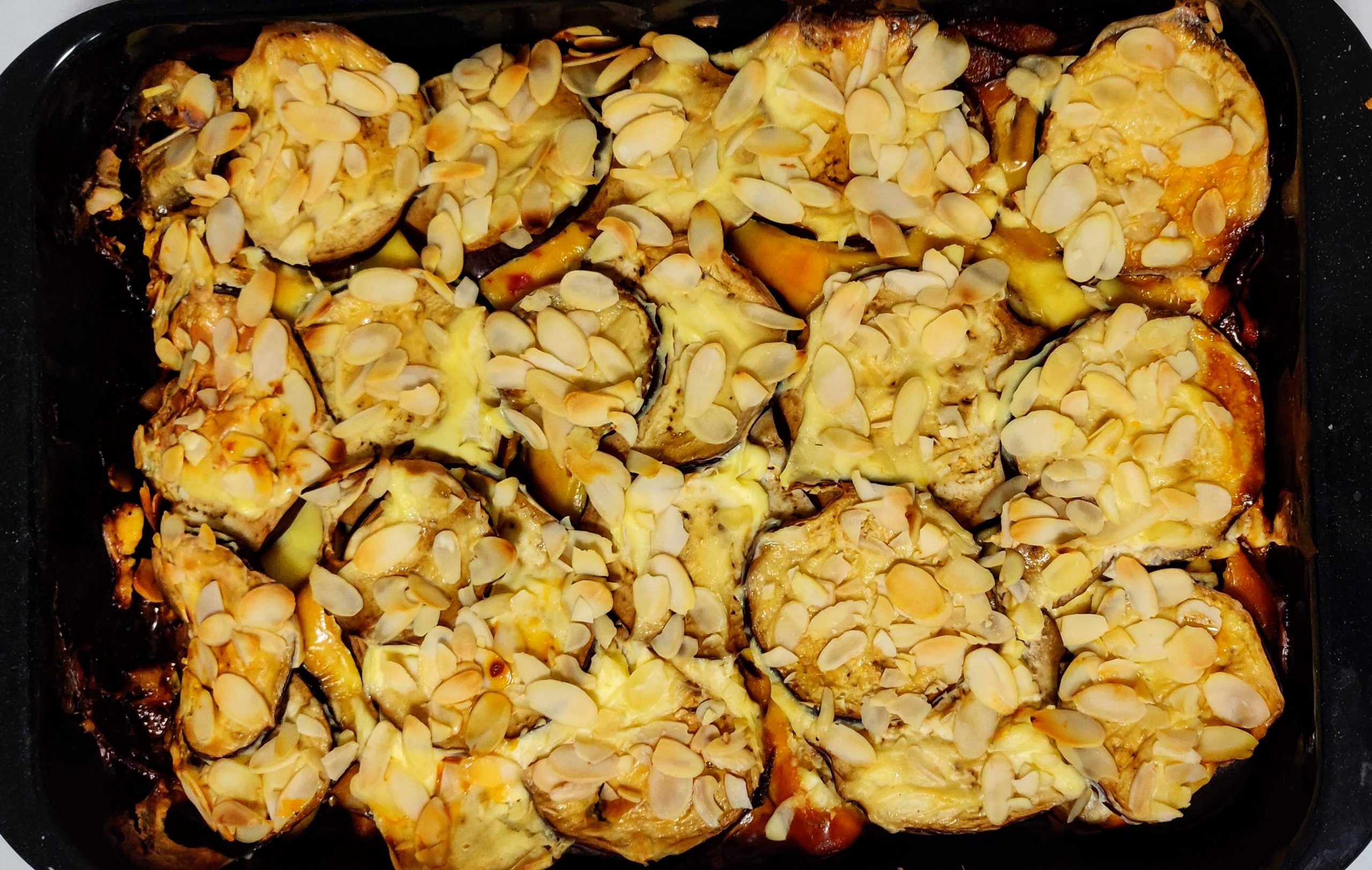 Aubergine and other vegetable bake sprinkled with almonds